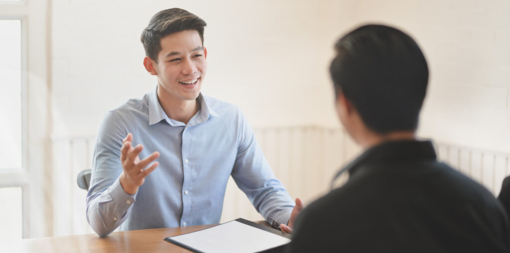 Professional businessman explaining his idea to his team member