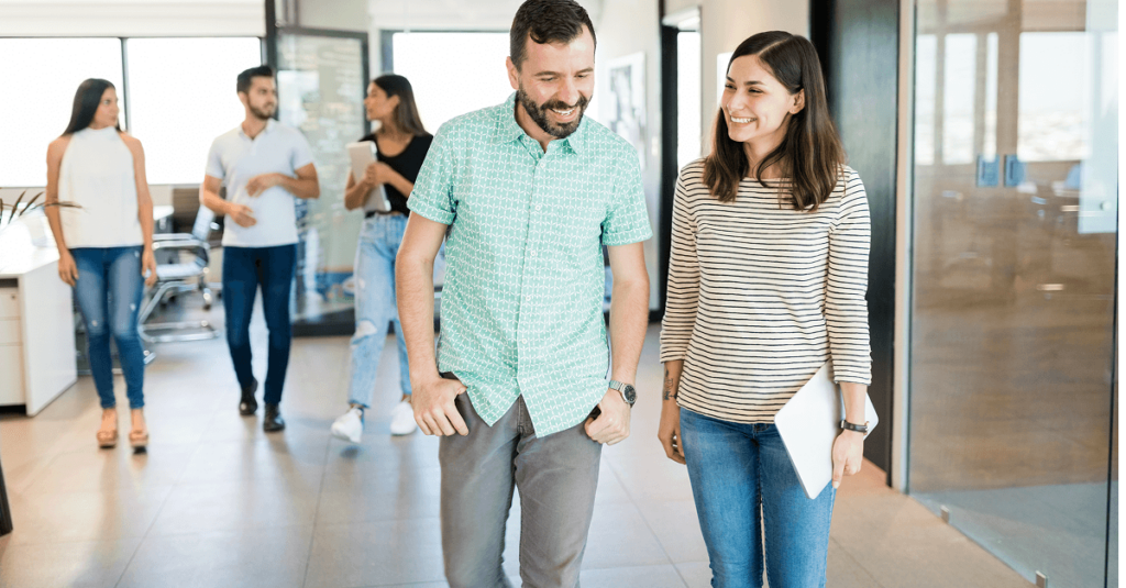 Two people walking and talking