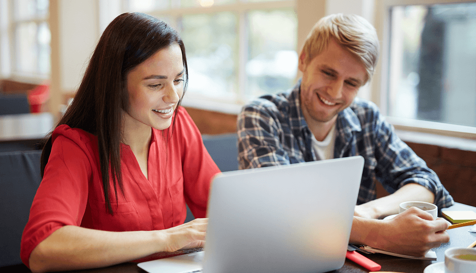 couple reviewing the chatbot benefits for their business